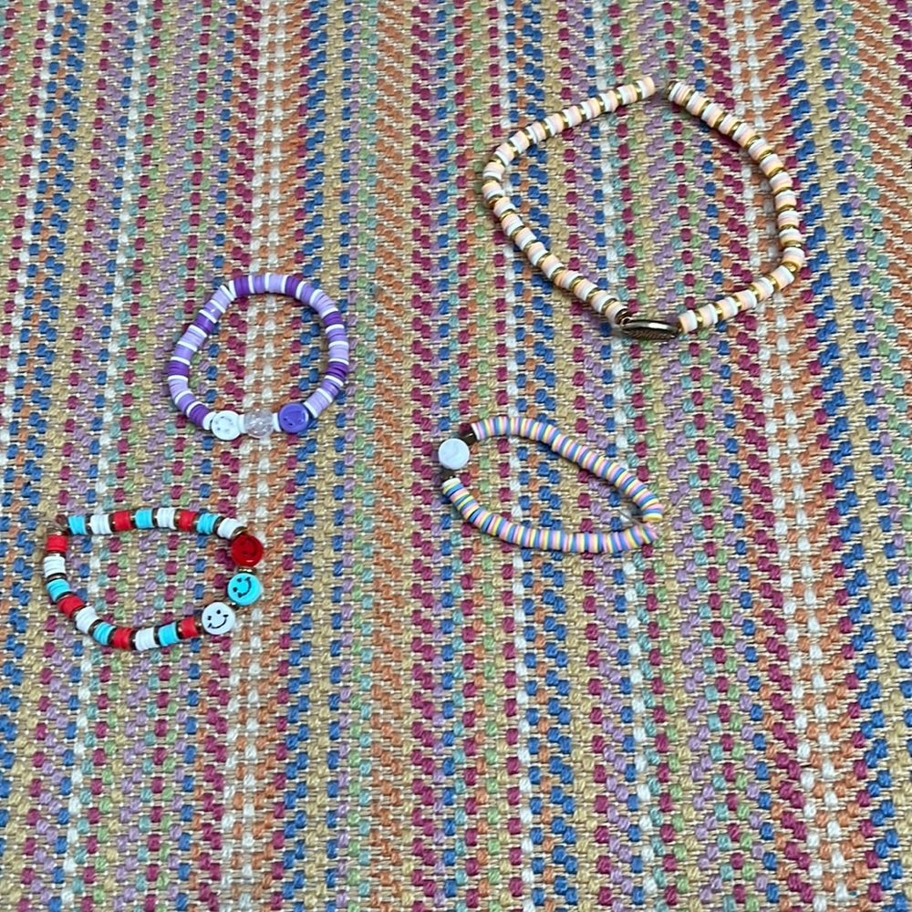 3 clay head braclet and one clay head necklace